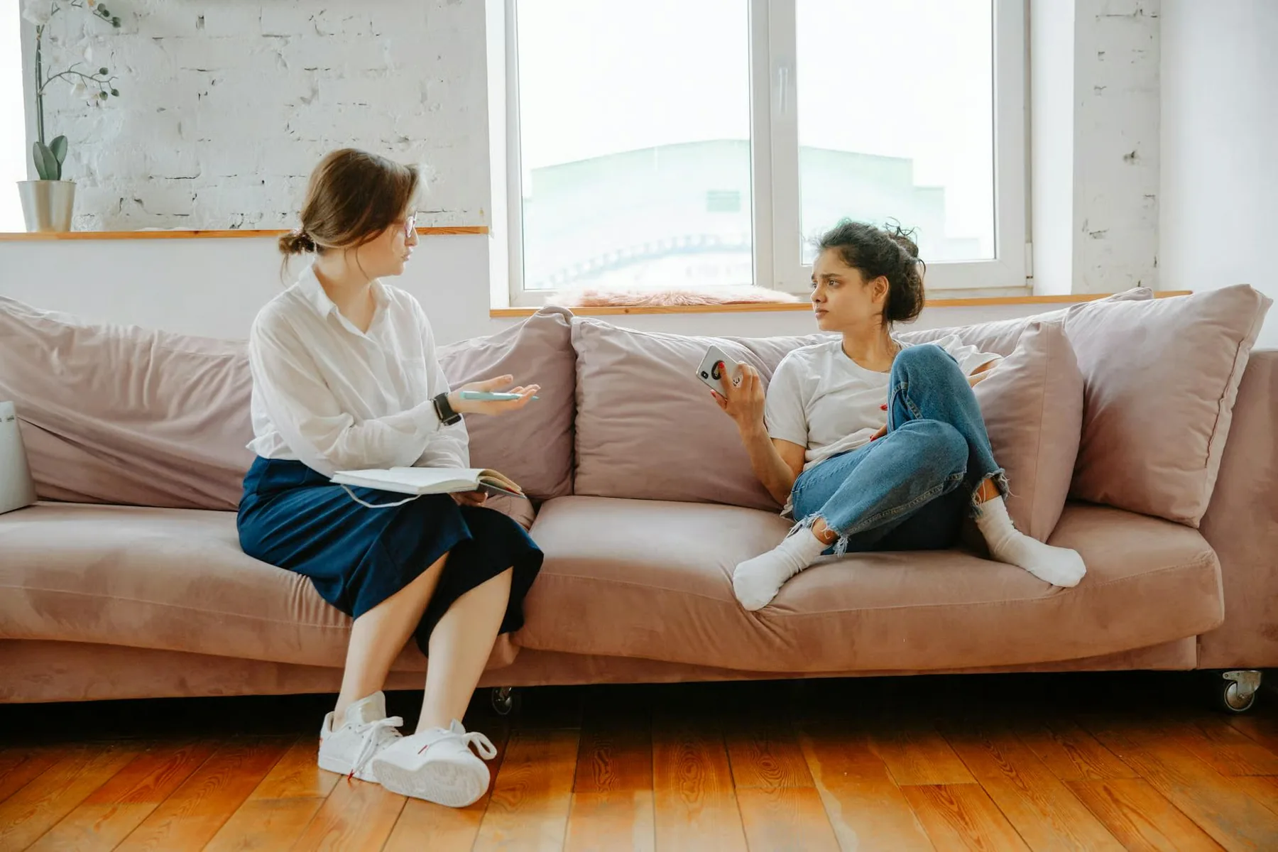 A therapist and client in warm conversation
